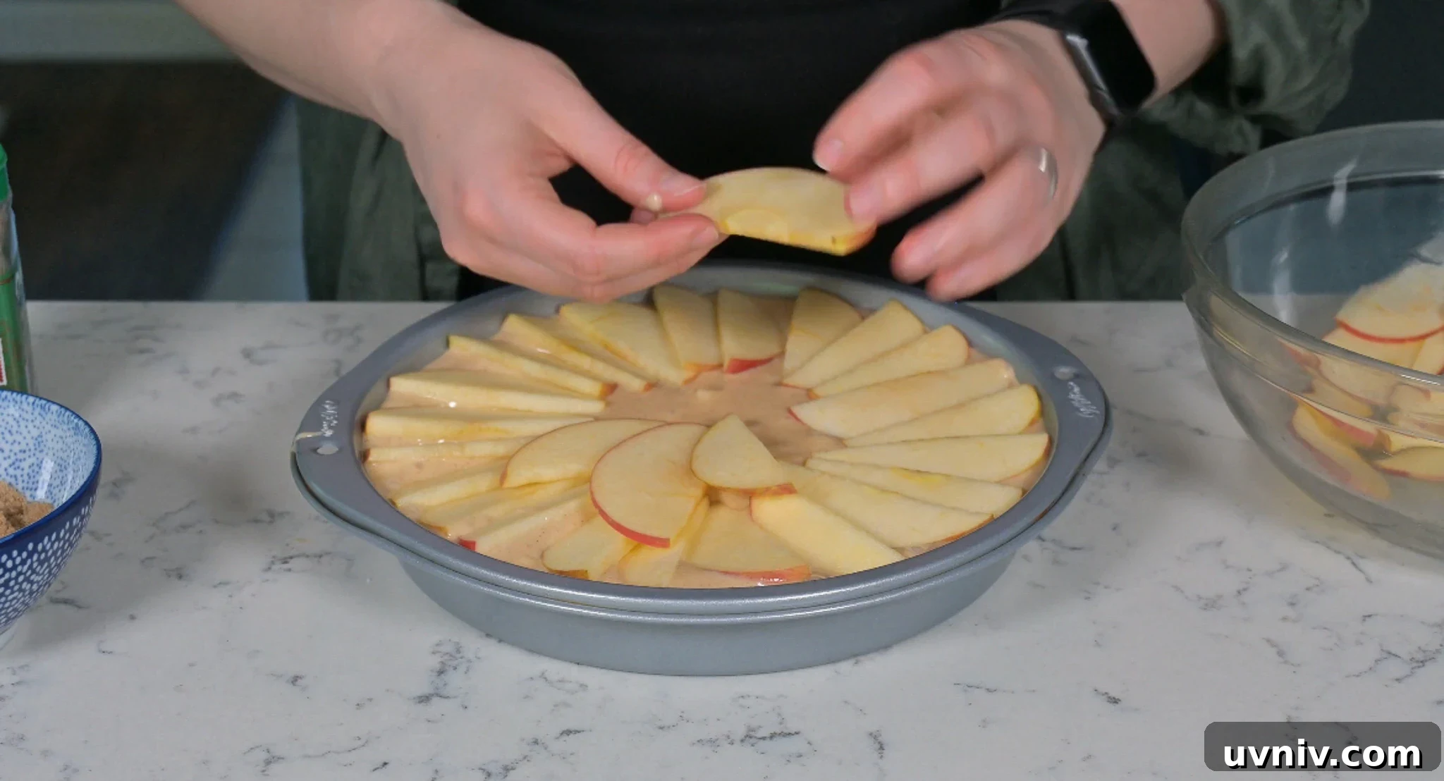 Classic Danish Æblekage Recipe — Rustic Apple Cake with Crumbs 21 Arranging apples on the cake.
