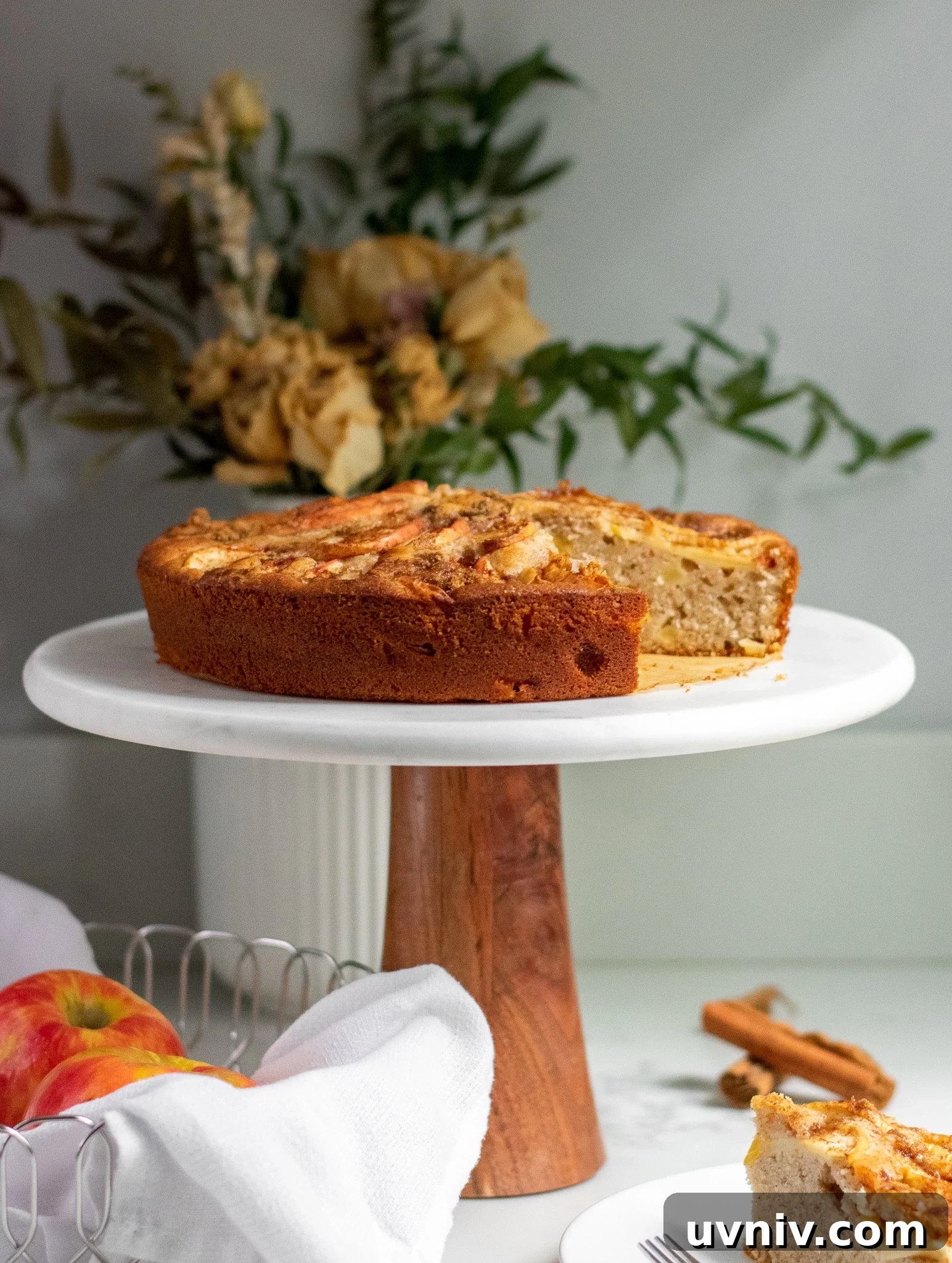 Classic Danish Æblekage Recipe — Rustic Apple Cake with Crumbs 8 Apple cake on a cake stand topped with cinnamon and brown sugar.