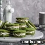 filled matcha sandwich cookies stacked on serving platter