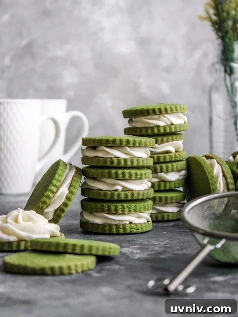Matcha Cream Sandwich Cookies: Soft Green Tea Cookie Recipe 5 filled matcha sandwich cookies stacked on tabletop
