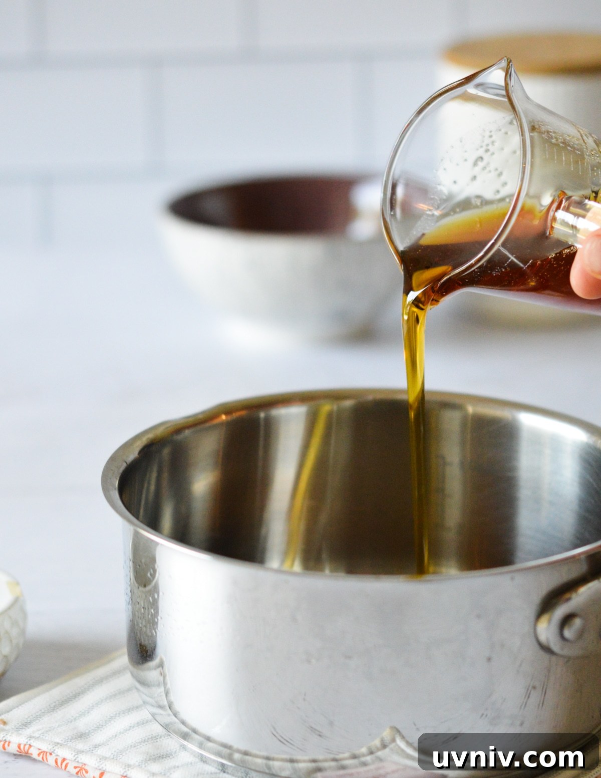 Spicy Maple Syrup Recipe: Sweet Heat for Breakfast & Glaze 4 pouring maple syrup into a small saucepan.
