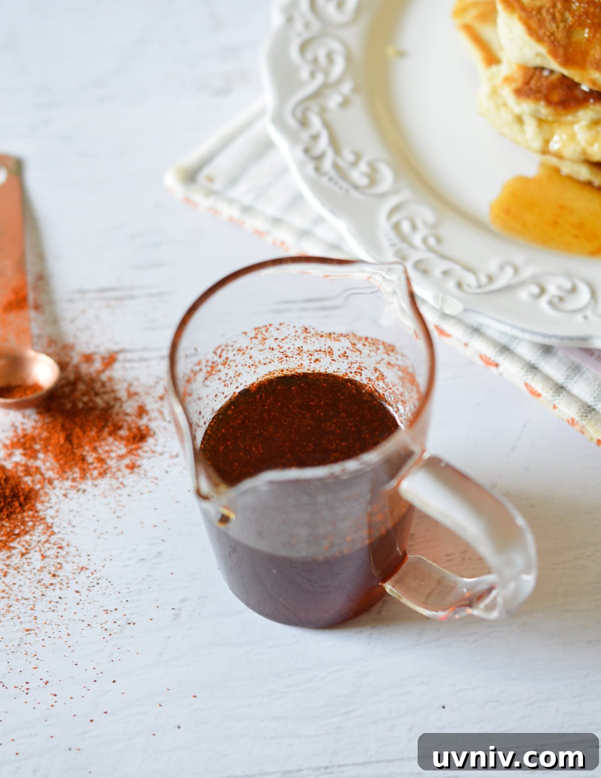 Spicy Maple Syrup Recipe: Sweet Heat for Breakfast & Glaze 7 spicy maple syrup in a glass.