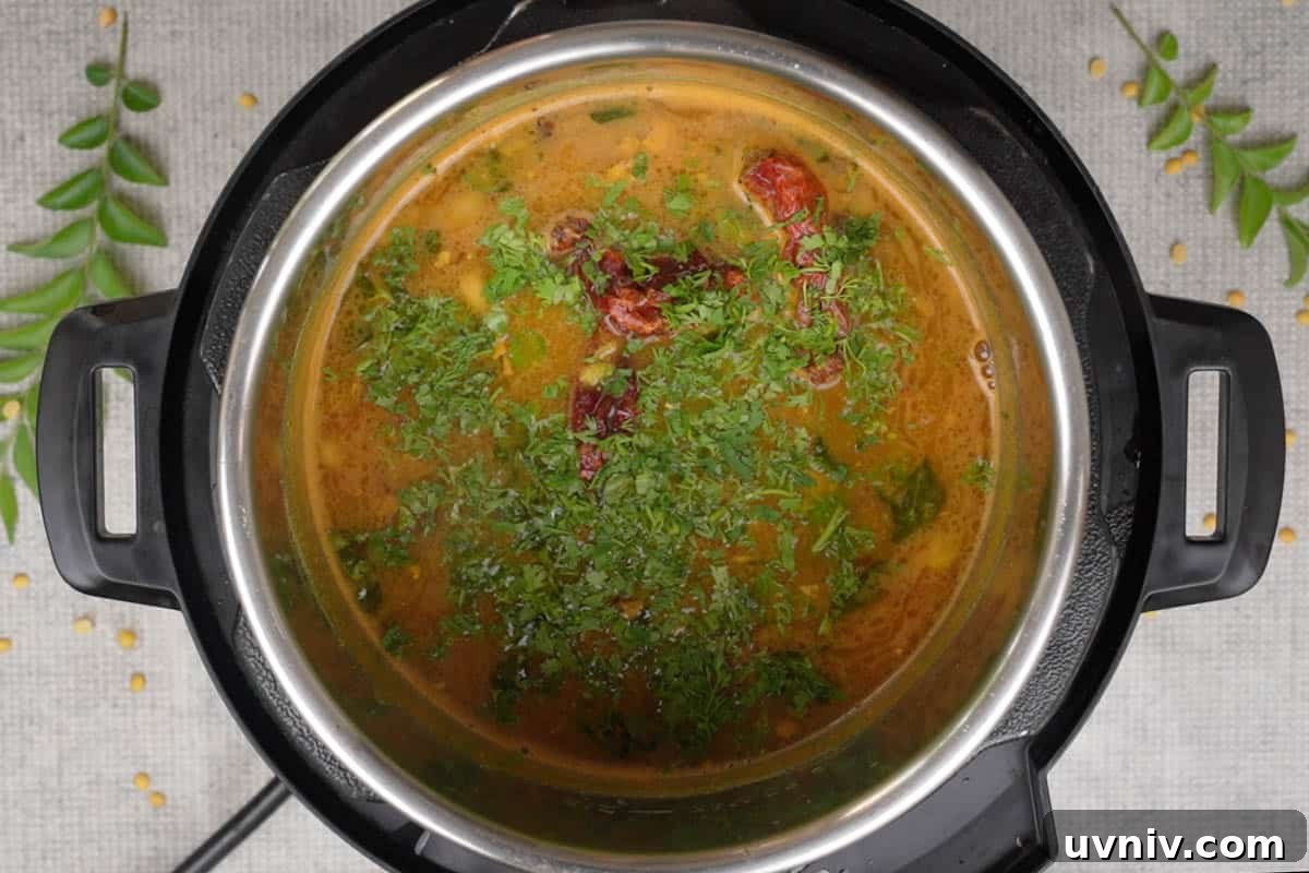 Gujarati Dal Recipe: Authentic Spiced Lentils from Gujarat 9 Tempering poured over ready Gujarati dal.
