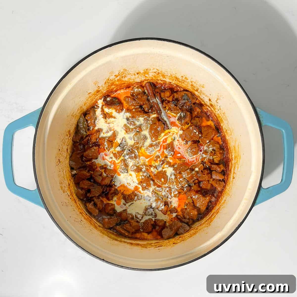 Coconut Milk Beef Curry Recipe: Rich, Creamy, Slow-Simmered 13 Adding cream to the beef coconut curry.