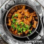 Coconut Milk Beef Curry Recipe: Rich, Creamy, Slow-Simmered 19 Aromatic beef curry with coconut milk in a balti bowl with a side of rice.