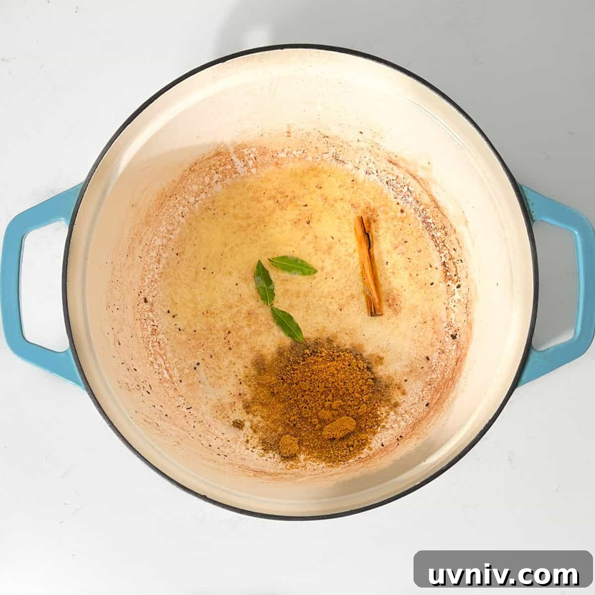 Coconut Milk Beef Curry Recipe: Rich, Creamy, Slow-Simmered 7 Adding the bay leaves and curry powder to the butter in a large saucepan.