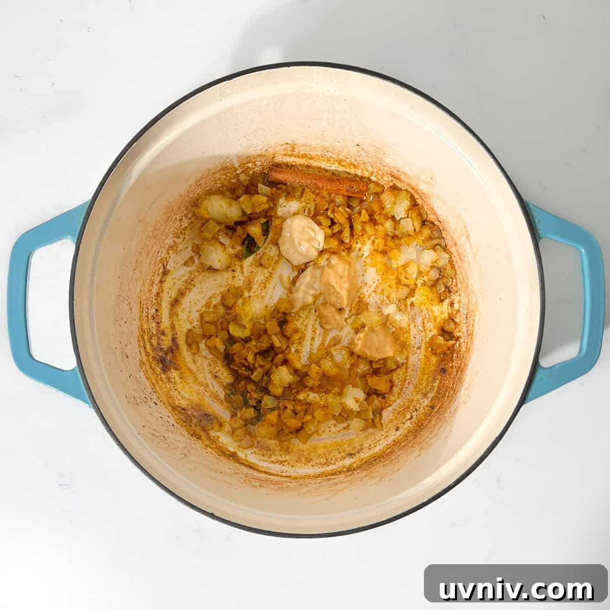 Coconut Milk Beef Curry Recipe: Rich, Creamy, Slow-Simmered 9 Adding garlic and ginger to the fried onions in a large saucepan.