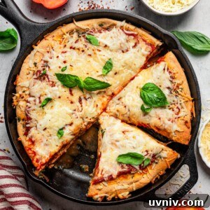 Chicago-Style Deep Dish Pizza: Ultimate Guide to Making It at Home 2 Overhead image of a deep dish pizza in a skillet.