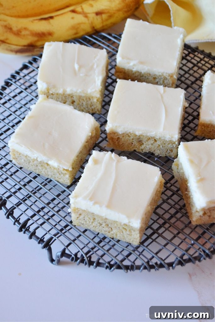 banana bars arranged randomly on a black wire rack with bananas next to it