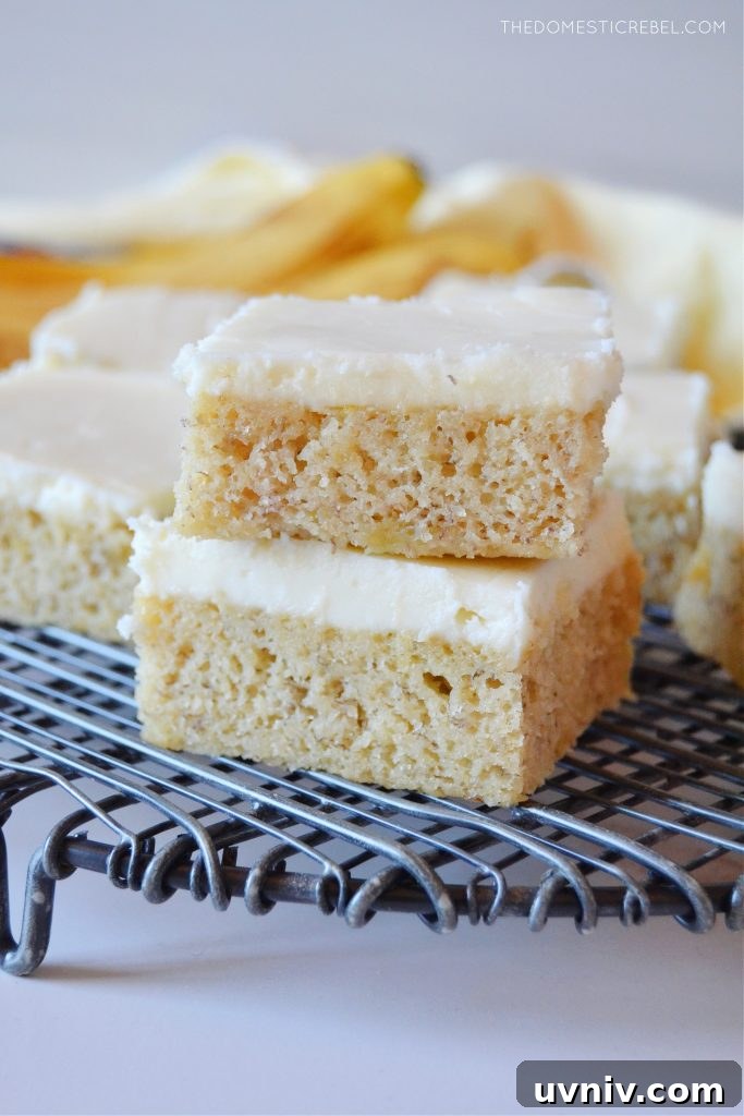 a double stack of banana bars on a black wire rack