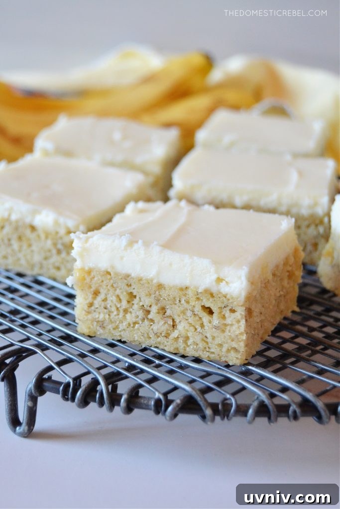 closeup of banana bars arranged on a black wire rack