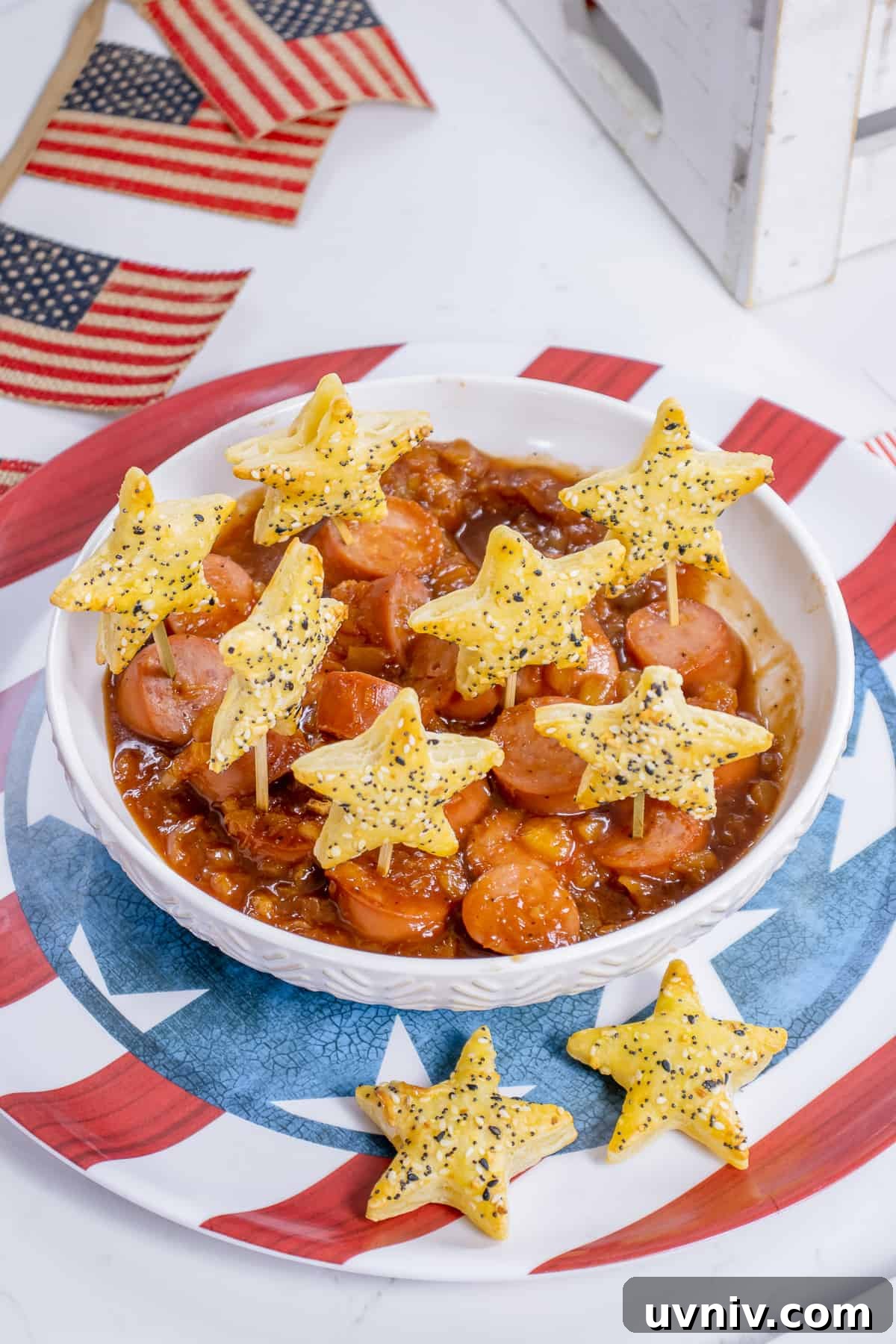 Patriotic Kielbasa Bites with Creamy Mustard Dip 2 Puff pastry stars with kielbasa bites.