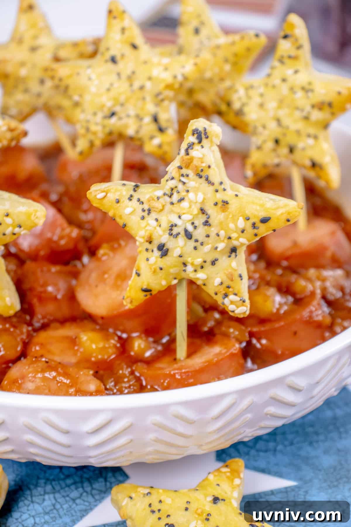 Patriotic Kielbasa Bites with Creamy Mustard Dip 4 Puff pastry stars with kielbasa bites.