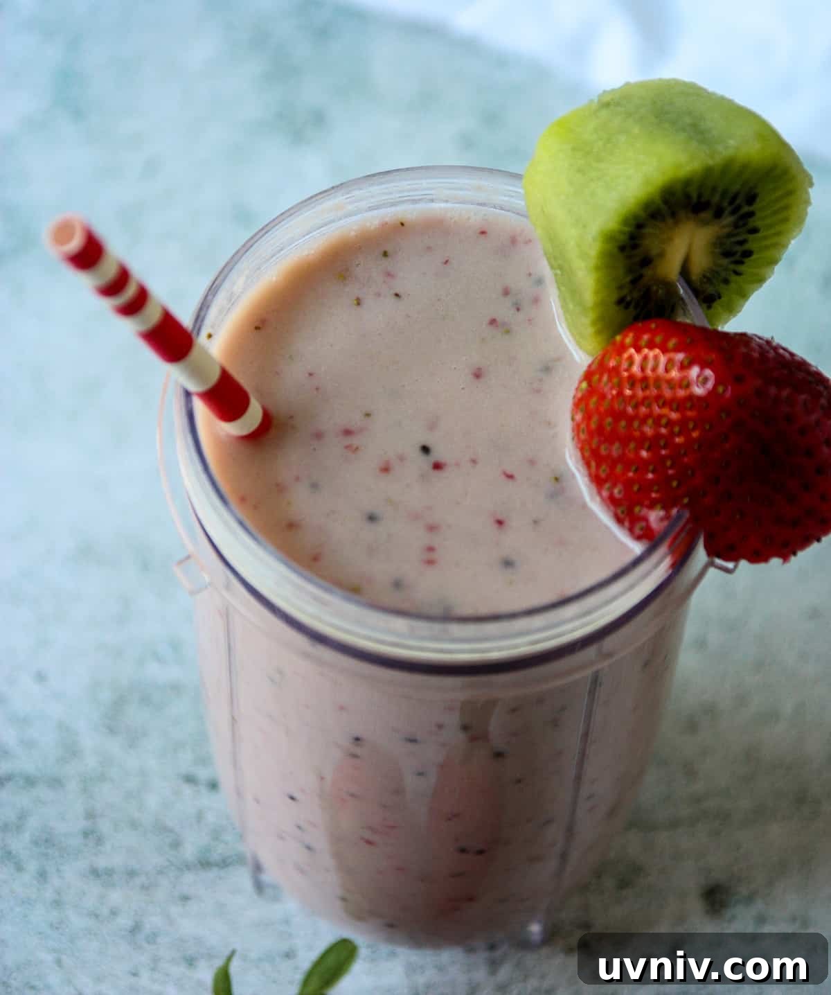 Pink smoothie in a glass.