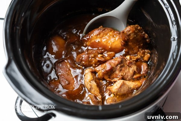 Slow Cooker Honey Mustard Chicken – Moist & Flavorful Recipe 5 cooked slow cooker honey mustard chicken with spoon