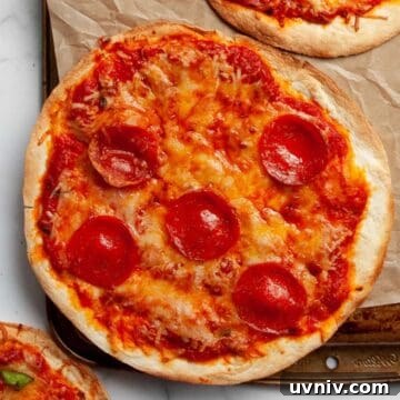 Air fryer tortilla pizza with crispy crust and melted mozzarella cheese.