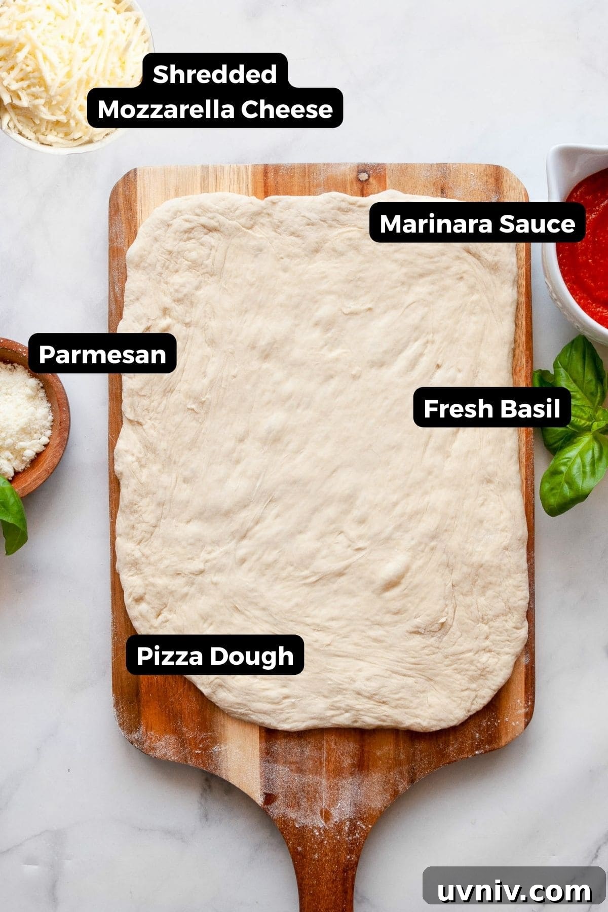Crispy Air Fryer Pizza Rolls You Can Make at Home 3 Ingredients for homemade air fryer pizza rolls including pizza dough, marinara sauce, shredded mozzarella, parmesan, and fresh basil on a countertop.