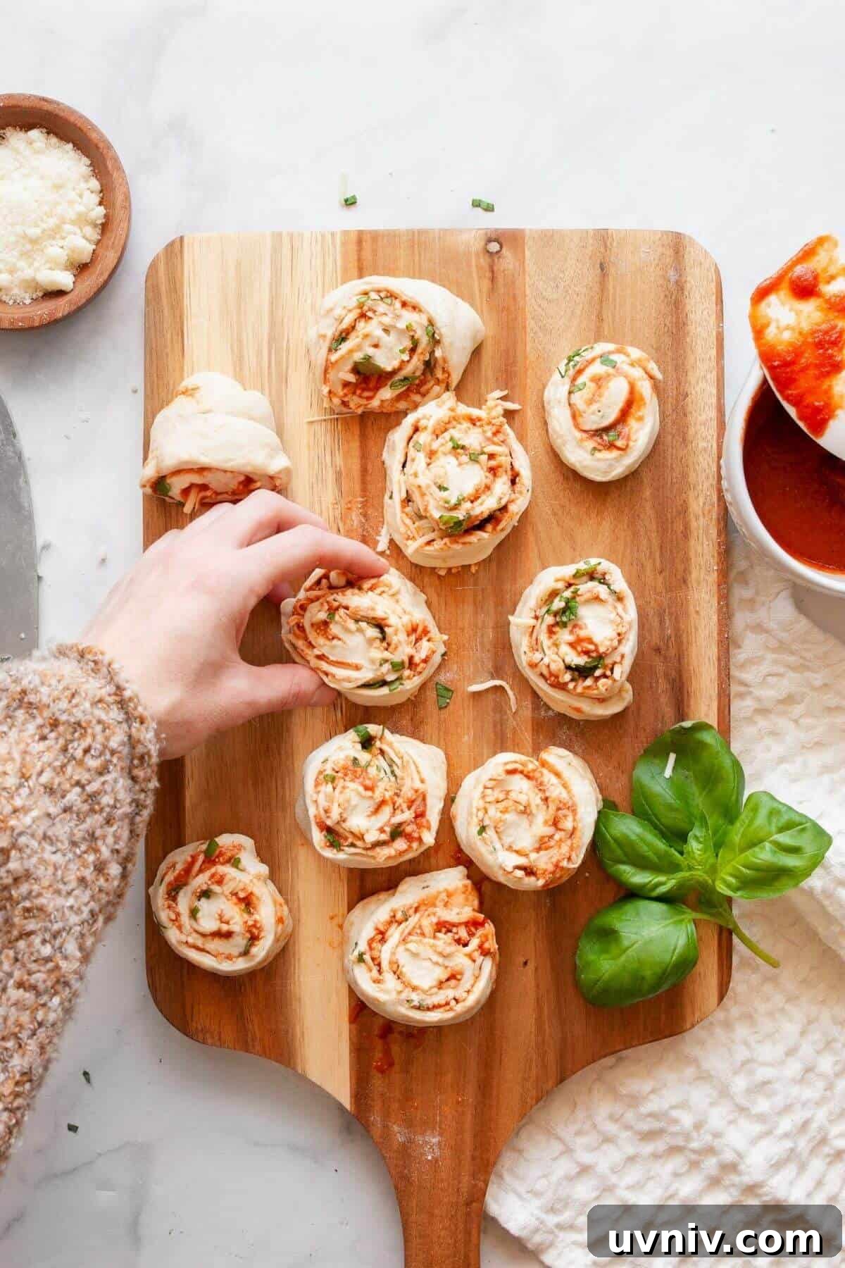 Crispy Air Fryer Pizza Rolls You Can Make at Home 8 Cutting rolled pizza dough into 1-inch slices and pinching the bottoms to seal homemade air fryer pizza rolls.