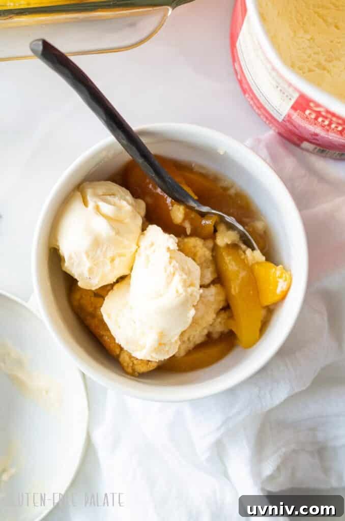 Labor Day Cooking & Baking Deals: Top Discounts on Kitchen Gear 6 gluten free peach cobbler in a white bowl topped with two scoops of vanilla ice cream