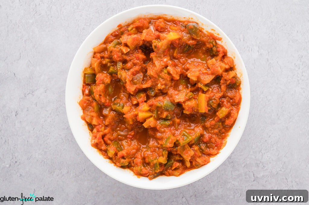 Labor Day Cooking & Baking Deals: Top Discounts on Kitchen Gear 9 Fully cooked gluten-free bell pepper salsa served in a white bowl, showing softened chunks of onion and pepper.