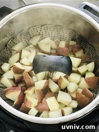 Creamy Loaded Potato Salad Made in the Instant Pot 18 pressure cooked potatoes in a steamer basket