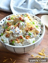 Creamy Loaded Potato Salad Made in the Instant Pot 23 loaded potato salad served in a white bowl
