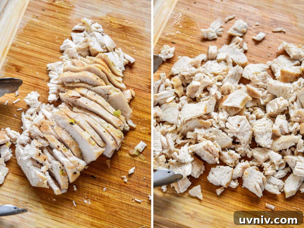 sliced and cut chicken breast on a wooden cutting board.