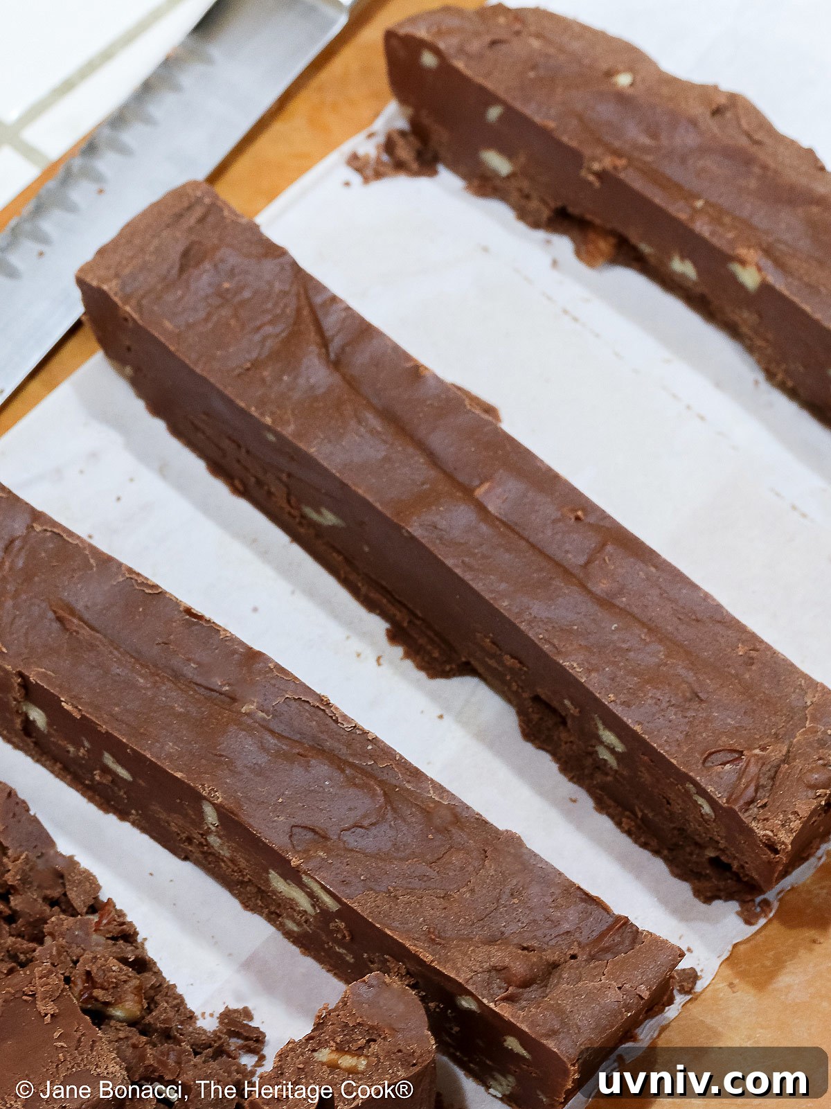 World’s Simplest Gluten-Free Fudge Recipe 3 Slab of fudge cut into long strips which will be cut into squares.