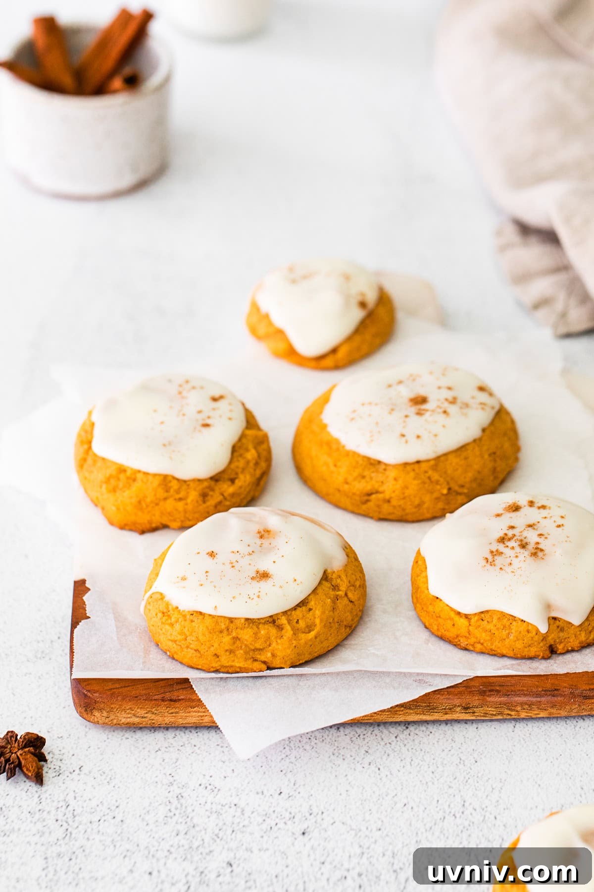 Soft Pumpkin Cookie Recipe for Moist, Fall-Ready Treats 7 Soft Pumpkin Cookies topped with cream cheese frosting.