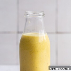 creamy garlic dressing in a small glass jar