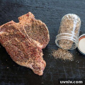 Ultimate Steak Rub Recipe for Bold, Smoky Flavor 7 steak rub jar spilled next to seasoned porterhouse steak