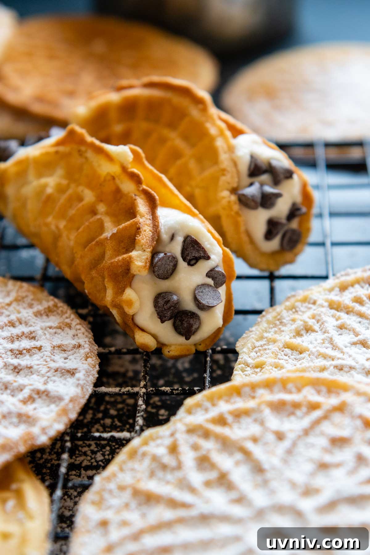 image of pizzelles shaped into cannoli shells