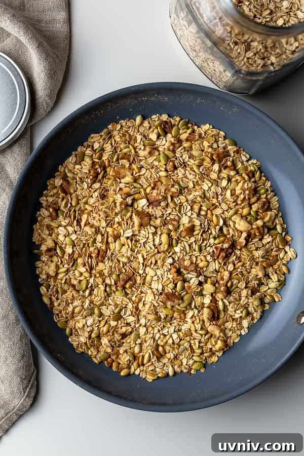 Crispy Oven-Baked Granola Without Oil: Crunchy Homemade Recipe 4 Toasting walnuts and pumpkin seeds in a non-stick skillet.