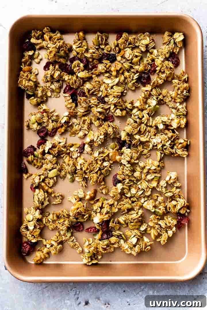 Crispy Oven-Baked Granola Without Oil: Crunchy Homemade Recipe 6 homemade granola recipe cooling on a cookie sheet