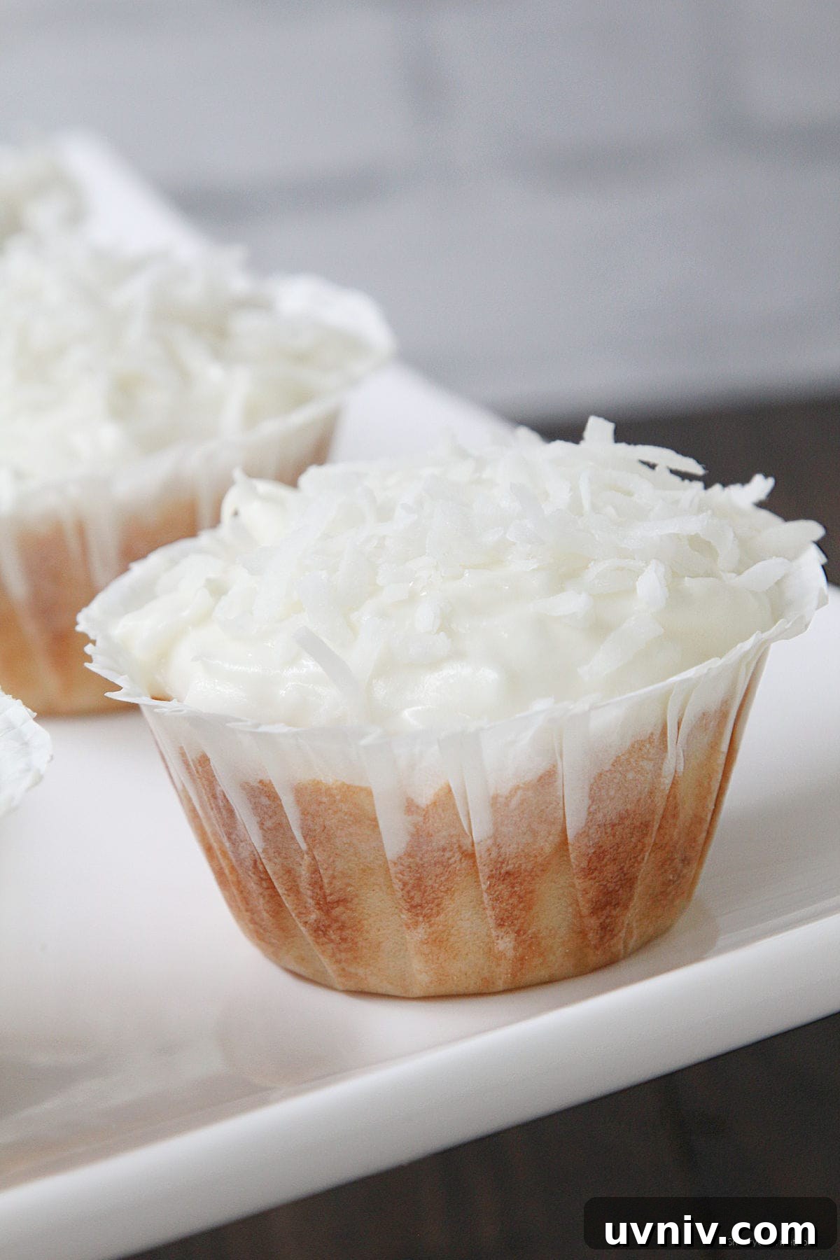 homemade Coconut Cupcakes on cake platter