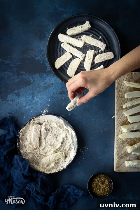 Crispy Air Fryer Halloumi Fries Recipe (UK) 7 Halloumi fries being coated in seasoned flour