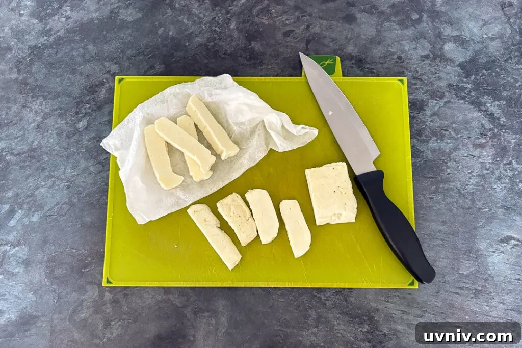 Crispy Air Fryer Halloumi Fries Recipe (UK) 10 Cur halloumi fries being dried with kitchen roll