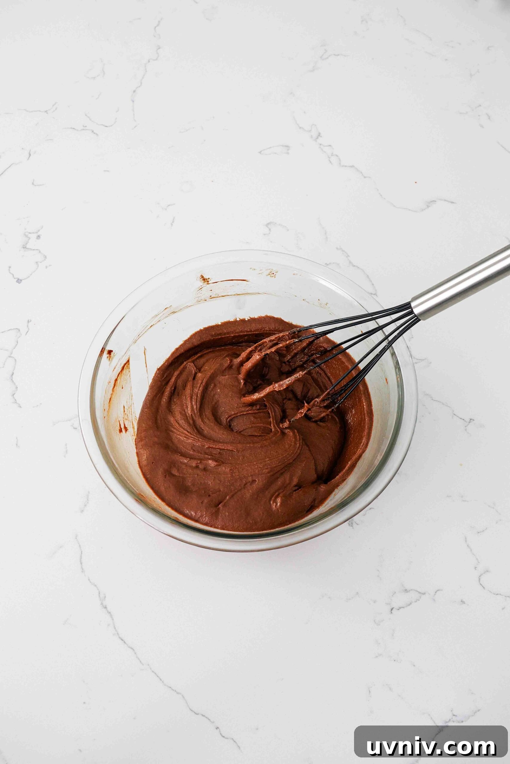 Decadent Peppermint Brownies Recipe for Holiday Baking 9 A whisk in a very thick chocolate batter.