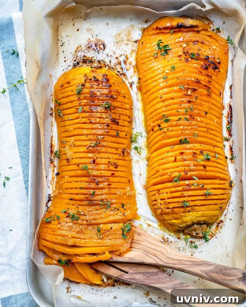 Crispy Hasselback Butternut Squash with Herb Butter 2 top view of two Hasselback butternut squash on a baking pan