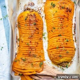Crispy Hasselback Butternut Squash with Herb Butter 11 top view of two Hasselback butternut squash on a baking pan