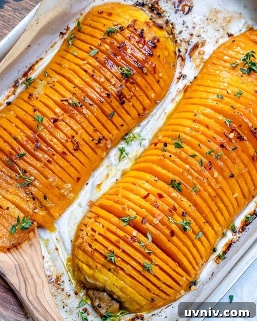 Crispy Hasselback Butternut Squash with Herb Butter 4 top view of two Hasselback butternut squash on a baking pan