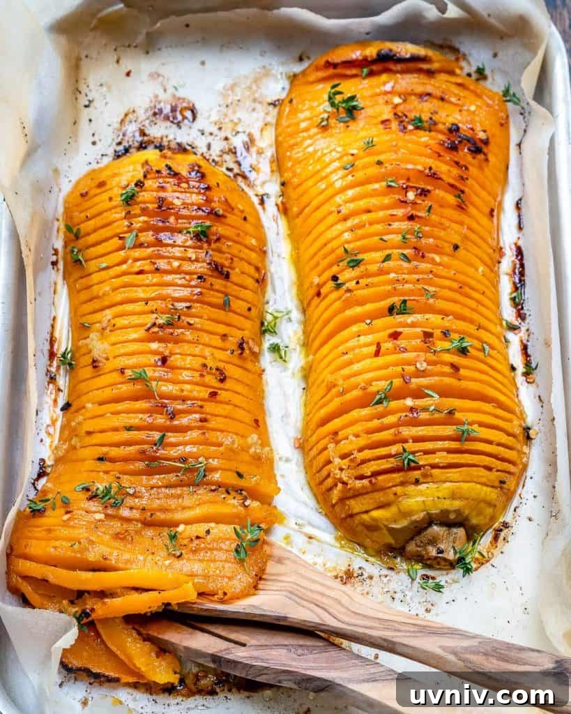 Crispy Hasselback Butternut Squash with Herb Butter 9 top view of two Hasselback butternut squash on a baking pan