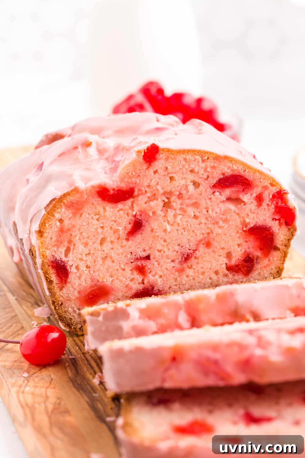 front view of cherry bread after three slices being sliced