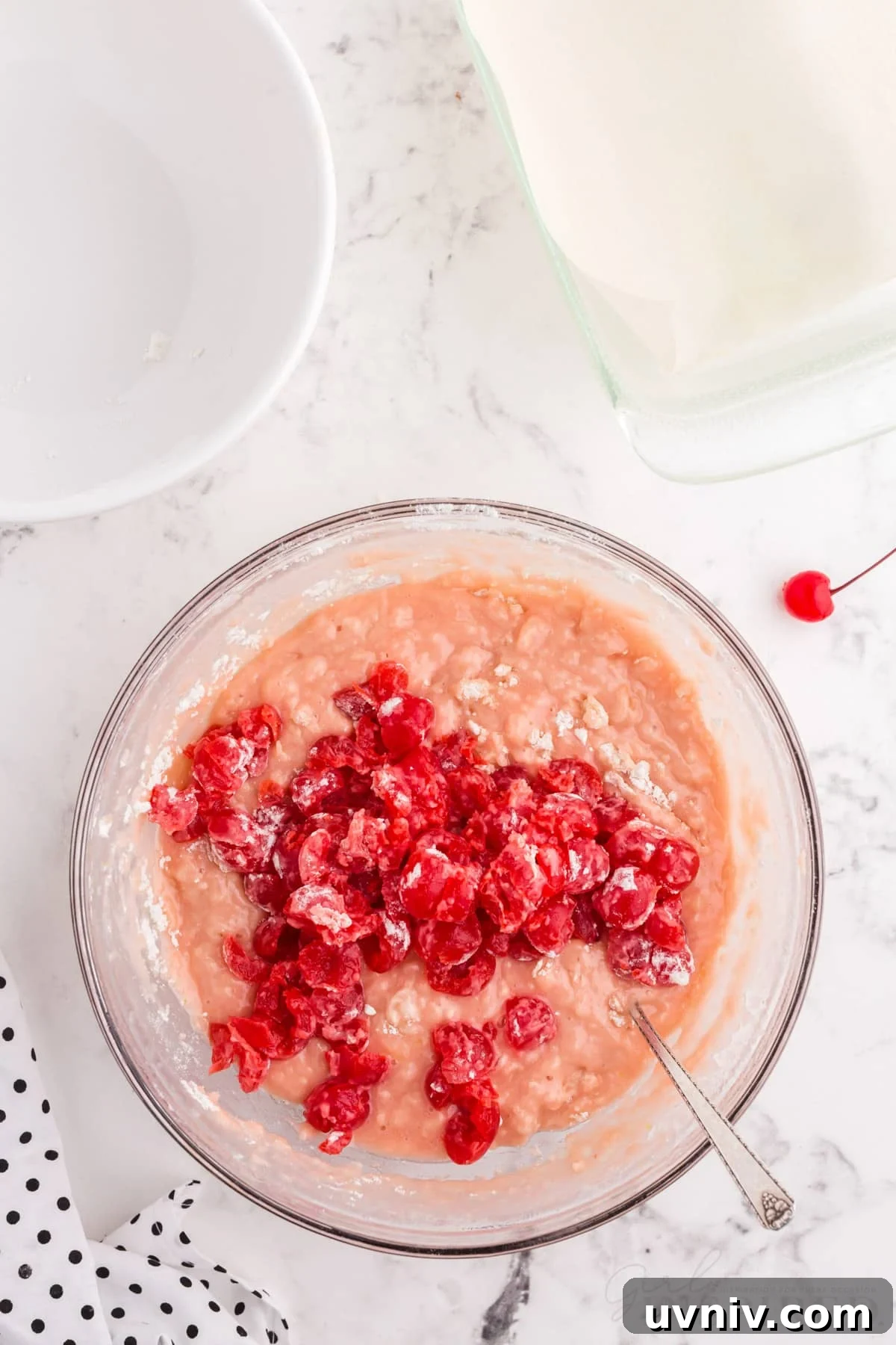 cherries added to cherry juice mixture in bowl for cherry bread