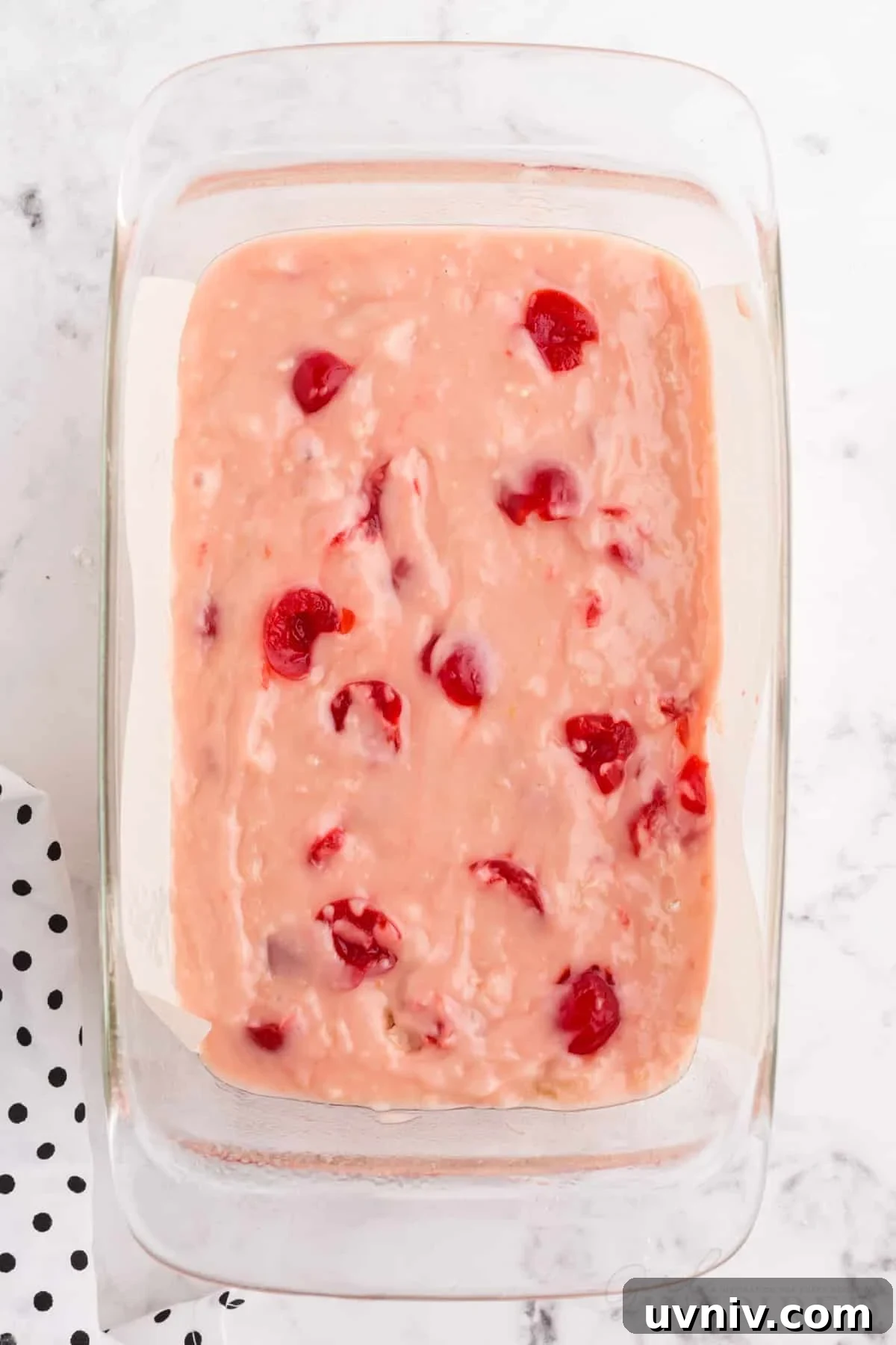 cherry bread batter in a 9x5 loaf pan