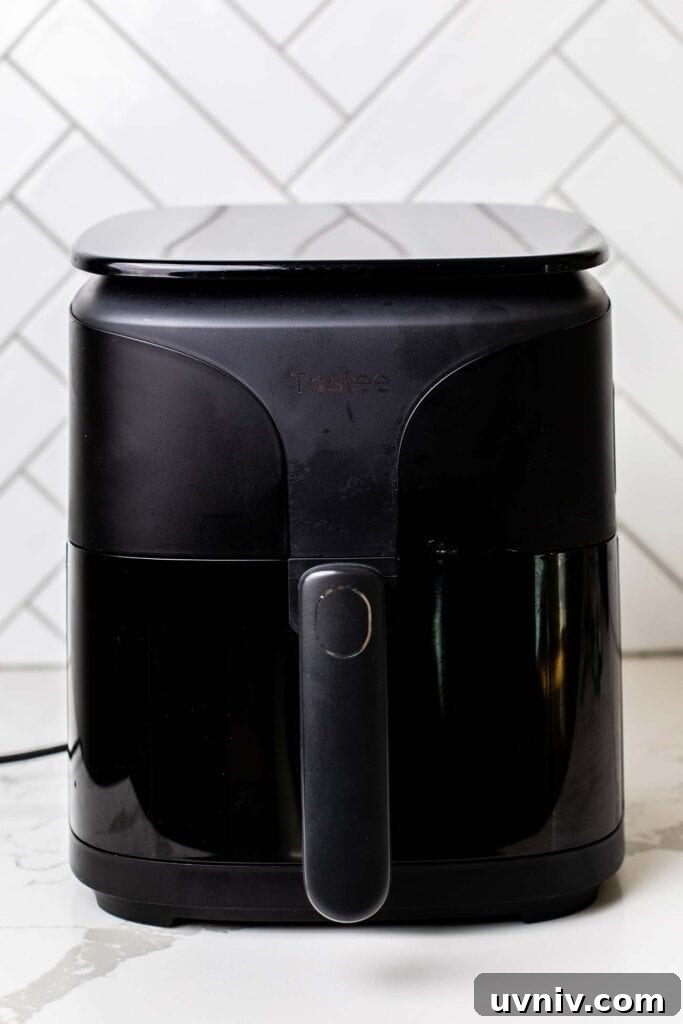 Perfect Air Fryer Hard-Boiled Eggs That Peel Easily 4 An air fryer preheating.