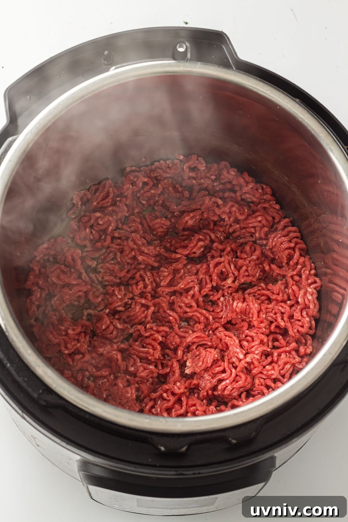 Instant Pot Spaghetti with Savory Meat Sauce 4 Lean ground beef browning in an Instant Pot.