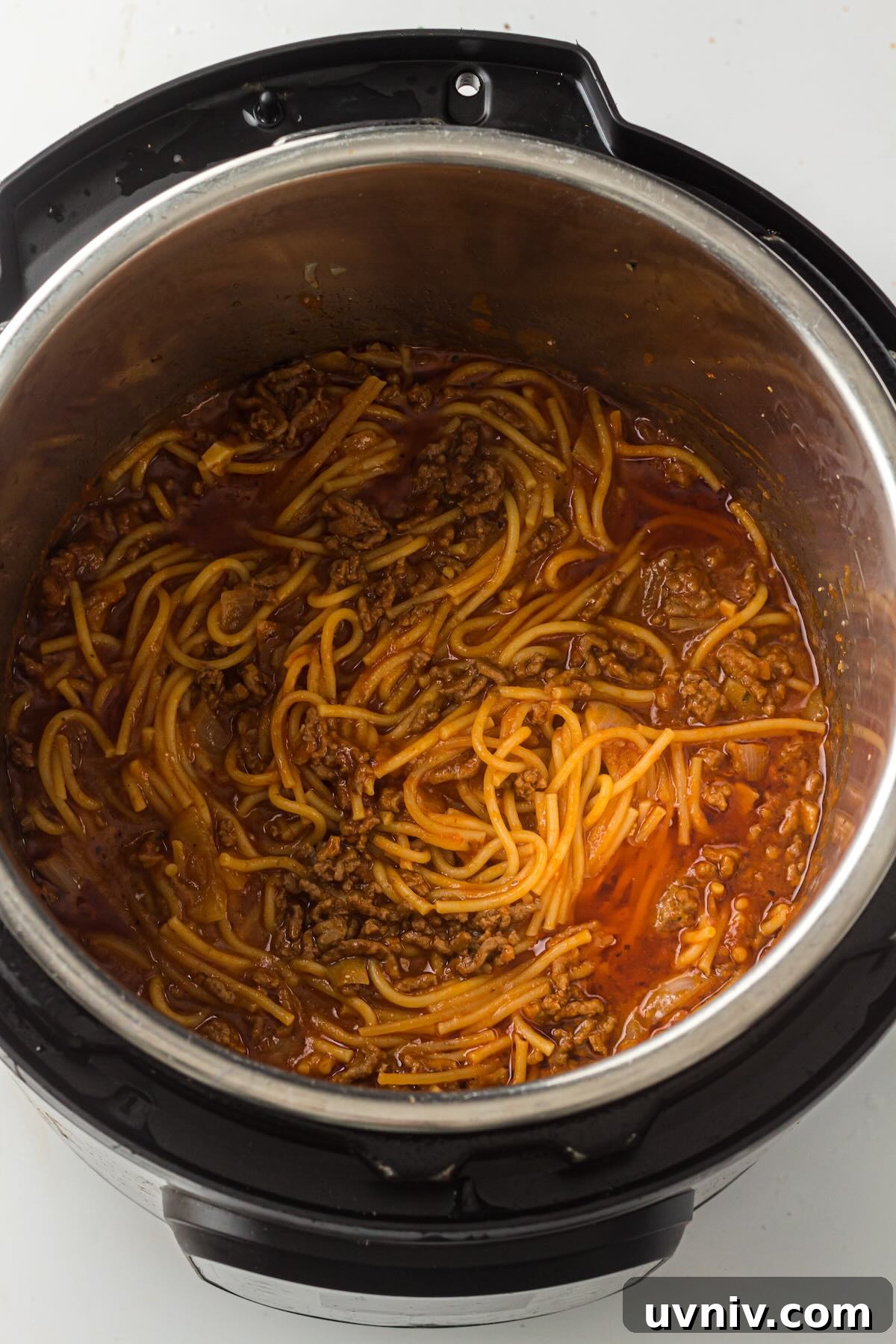 Instant Pot Spaghetti with Savory Meat Sauce 8 Cooked spaghetti and meat sauce mixed together after natural pressure release in the Instant Pot.