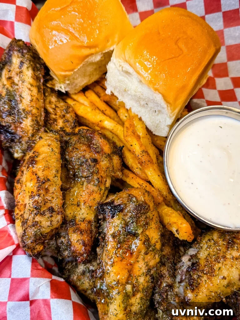Crispy Ranch Chicken Wings Recipe for Game Day and Parties 2 ranch chicken wings on a plate with ranch dressing