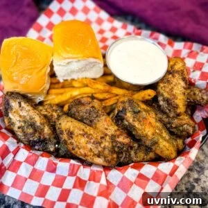 Crispy Ranch Chicken Wings Recipe for Game Day and Parties 7 ranch chicken wings on a plate with ranch dressing